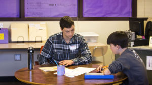 Achievement Connections math tutor works with high school student