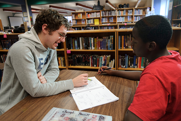 On Nov. 18, 2010, Trevor Mellenberger, left, a University of Wisconsin-Madison undergraduate and member of Badger Volunteers, reviews a writing exercise with sixth grader Joseph Schreiber-Poznik during an after-school tutoring program at Velma Hamilton Middle School in Madison, Wis. Badger Volunteers, initiated in Fall 2008 and coordinated by the UW-Madison Morgridge Center for Public Service, sends 70 student teams to 50 community-partner sites. More than 400 students participate each semester.
©UW-Madison University Communications 608/262-0067
Photo by: Jeff Miller
Date:  11/10    File#:  NIKON D3 digital frame 1982