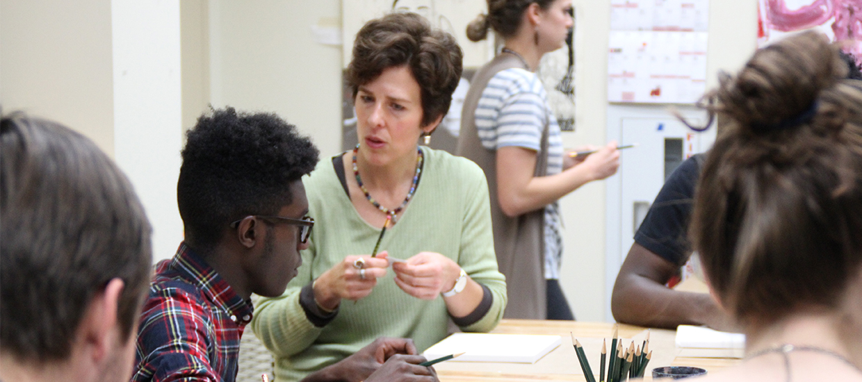 Kathy Cramer working with student