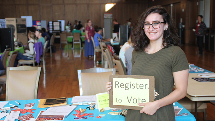 Caitlin Attaway registers voters at this year's Public Service Fair.