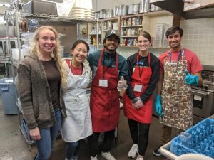 Konishi with other volunteers at River Food Pantry