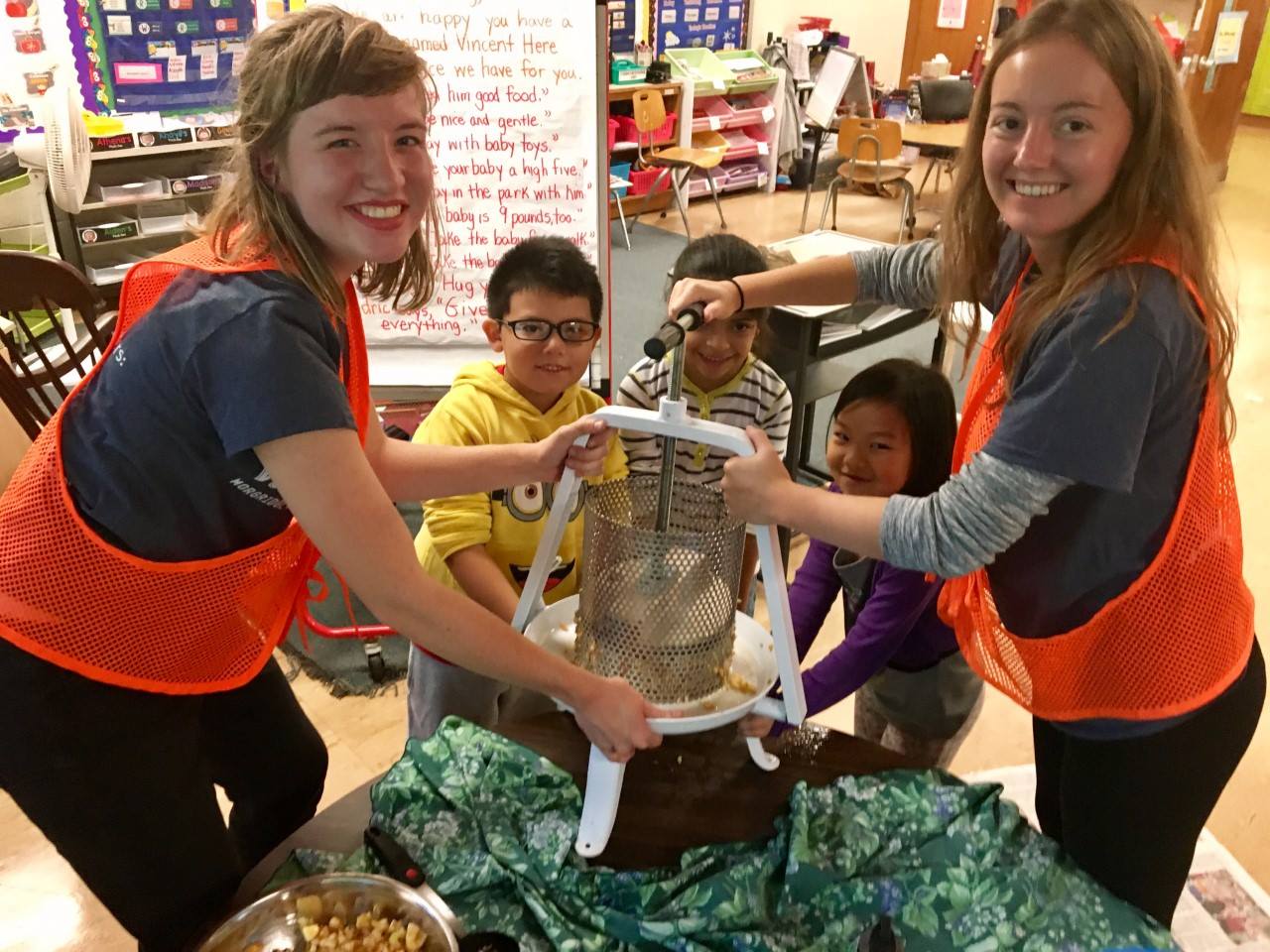 McBride's Badger Volunteers Team at Lakeview Elementary School's environmental education program making homemade apple cider with the students.