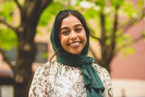 Hibah Ansari smiling in a headshot.